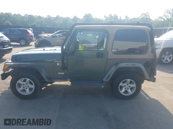 2002 Jeep Wrangler X with VIN 1J4FA39S72P733034, listed as a IAAI auction lot 42659447 with 200,786 mi miles and . Bid and sale history available at DreamBid. Image 14.