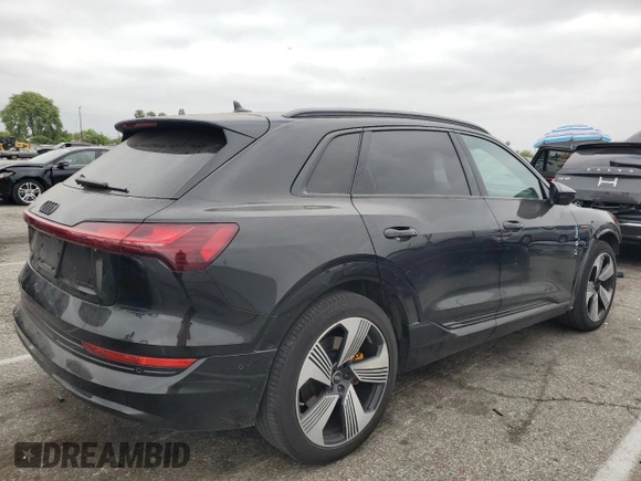 2022 Audi e-tron Premium Plus with VIN WA1LAAGE4NB014605, listed as a Copart auction lot 61127385 with 26,355 mi miles and Salvage title. Bid and sale history available at DreamBid. Image 3.
