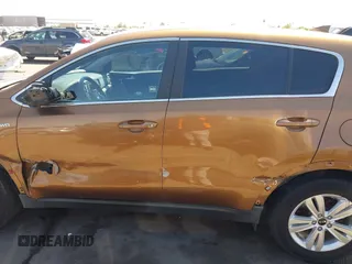 2017 Kia Sportage LX z VIN KNDPMCAC5H7121297, wystawiony jako IAAI lot #42088915 z przebiegiem 91 374 mil mil oraz . Historia ofert i sprzedaży dostępna na DreamBid. Obrazek 14.