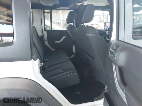 2015 Jeep Wrangler Unlimited Rubicon with VIN 1C4BJWFG9FL744927, listed as a IAAI auction lot 42169740 with 106,352 mi miles and . Bid and sale history available at DreamBid. Image 8.