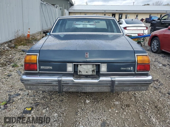 1985 Oldsmobile Delta Royale z VIN 1G3BN69YXF9080322, wystawiony jako Copart lot #78670094 z przebiegiem 58 231 mil mil oraz Tytuł czysty. Historia ofert i sprzedaży dostępna na DreamBid. Obrazek 6.