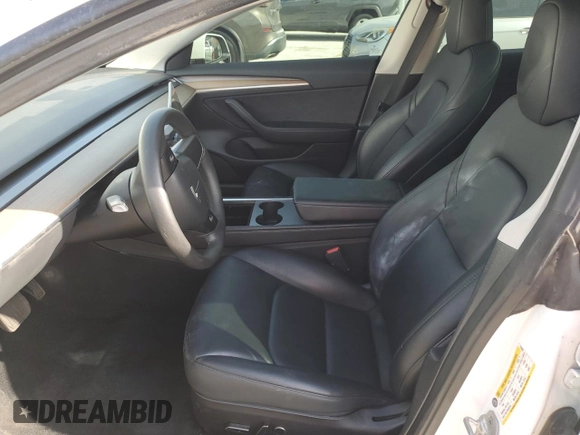 2023 Tesla Model 3 with VIN 5YJ3E1EA6PF510323, listed as a Copart auction lot 52094495 with 115,928 mi miles and Salvage Title. Bid and sale history available at DreamBid. Image 7.