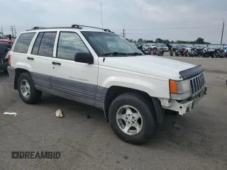 1997 Jeep Grand Cherokee Laredo with VIN 1J4GZ58S2VC676652, listed as a Copart auction lot 64939974 with 256,923 mi miles and Salvage Title. Bid and sale history available at carsss.com. Image 4.