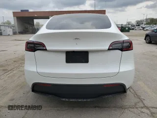 2023 Tesla Model Y Long Range z VIN 7SAYGAEE9PF686434, wystawiony jako Copart lot #54593475 z przebiegiem Nie podano mil oraz Szkoda całkowita • Salvage title. Historia ofert i sprzedaży dostępna na DreamBid. Obrazek 6.