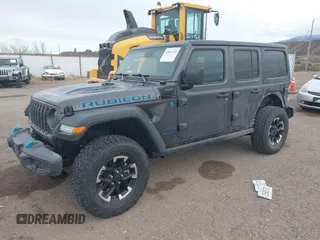 2024 Jeep Wrangler Rubicon z VIN 1C4RJXR67RW276710, wystawiony jako IAAI lot #42047318 z przebiegiem 35 857 mil mil oraz . Historia ofert i sprzedaży dostępna na DreamBid. Obrazek 2.