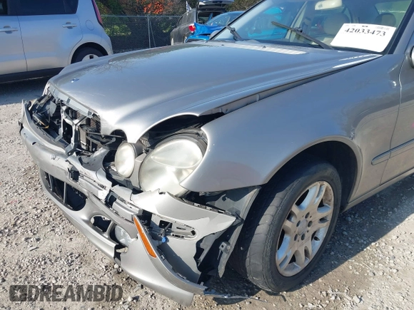 2003 Mercedes-Benz E-Class 3.2L with VIN WDBUF65J93X099223, listed as a IAAI auction lot 42033473 with 230,758 mi miles. Bid and sale history available at carsss.com. Image 18.