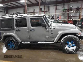 2013 Jeep Wrangler Unlimited Sport z VIN 1C4BJWDG3DL628784, wystawiony jako IAAI lot #41311183 z przebiegiem 125 118 mil mil oraz . Historia ofert i sprzedaży dostępna na DreamBid. Obrazek 13.