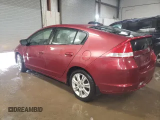 2010 Honda Insight LX with VIN JHMZE2H52AS034613, listed as a Copart auction lot 52701795 with 232,541 mi miles and Salvage Title. Bid and sale history available at DreamBid. Image 2.