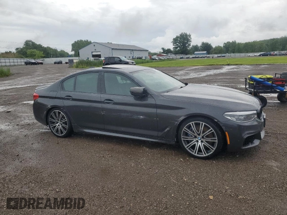 2020 BMW 5 Series M550i xDrive with VIN WBAJS7C06LCD12779, listed as a Copart auction lot 61136215 with 81,286 mi miles and Salvage title. Bid and sale history available at DreamBid. Image 4.