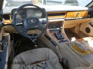 1990 Jaguar XJ with VIN SAJKY1745LC622713, listed as a Copart auction lot 56545414 with Not Provided miles and Salvage Title. Bid and sale history available at DreamBid. Image 8.
