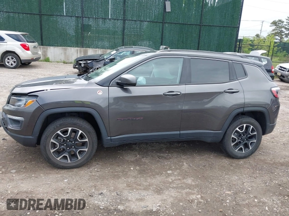 2020 Jeep Compass Trailhawk with VIN 3C4NJDDB3LT200268, listed as a IAAI auction lot 42250192 with 73,804 mi miles and . Bid and sale history available at DreamBid. Image 14.