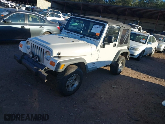 2004 Jeep Wrangler Sport Right Hand Drive with VIN 1J4F449S74P732854, listed as a IAAI auction lot 41408316 with 112,064 mi miles. Bid and sale history available at carsss.com. Image 17.