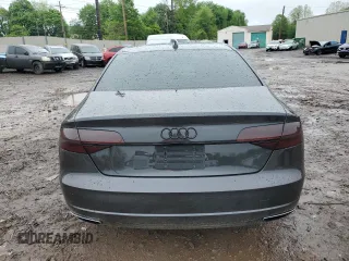2017 Audi A8 z VIN WAU44AFD0HN004258, wystawiony jako Copart lot #55283985 z przebiegiem 128 059 mil mil oraz Szkoda całkowita • Salvage title. Historia ofert i sprzedaży dostępna na DreamBid. Obrazek 6.