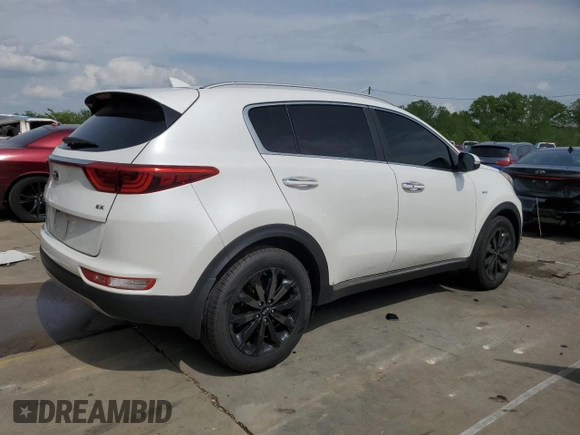 2019 Kia Sportage EX z VIN KNDPNCAC7K7522953, wystawiony jako Copart lot #54906835 z przebiegiem 128 011 mil mil oraz Szkoda całkowita • Salvage title. Historia ofert i sprzedaży dostępna na DreamBid. Obrazek 3.