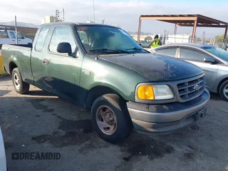 2004 Ford F-150 Heritage XL with VIN 2FTRX17284CA97950, listed as a IAAI auction lot 41443728 with 174,454 mi miles. Bid and sale history available at carsss.com. Image 1.