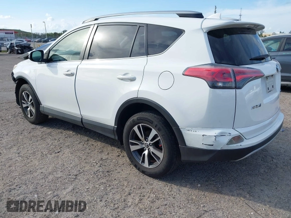 2018 Toyota RAV4 XLE with VIN JTMWFREV7JJ174483, listed as a IAAI auction lot 41597797 with 82,836 mi miles. Bid and sale history available at carsss.com. Image 3.