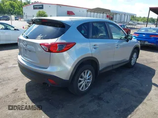 2016 Mazda CX-5 Touring z VIN JM3KE4CY4G0646114, wystawiony jako IAAI lot #42269181 z przebiegiem 58 252 mil mil oraz . Historia ofert i sprzedaży dostępna na DreamBid. Obrazek 4.
