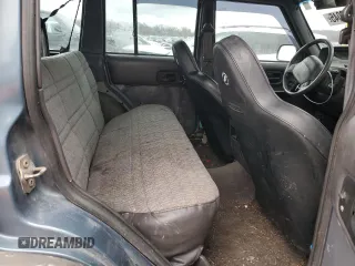 1999 Jeep Cherokee Sport with VIN 1J4FF68S4XL567848, listed as a Copart auction lot 43222045 with 280,178 mi miles and Salvage title. Bid and sale history available at DreamBid. Image 10.