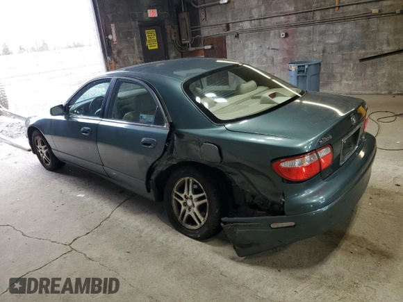 2000 Mazda Millenia z VIN JM1TA2212Y1610919, wystawiony jako Copart lot #80375014 z przebiegiem 127 938 mil mil oraz Szkoda całkowita • Salvage title. Historia ofert i sprzedaży dostępna na DreamBid. Obrazek 2.