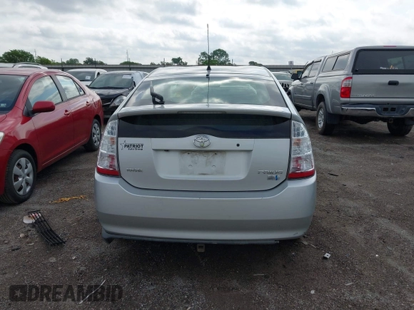 2007 Toyota Prius z VIN JTDKB20U873273942, wystawiony jako IAAI lot #42113046 z przebiegiem 126 635 mil mil oraz . Historia ofert i sprzedaży dostępna na DreamBid. Obrazek 17.