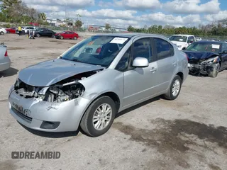 2012 Suzuki SX4 LE with VIN JS2YC5A30C6304324, listed as a IAAI auction lot 41585174 with 111,471 mi miles. Bid and sale history available at carsss.com. Image 2.