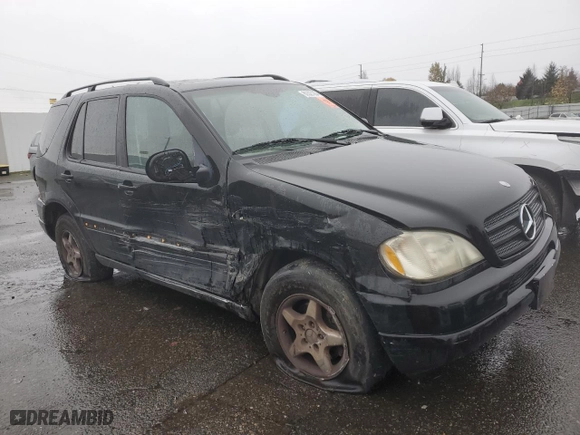 2001 Mercedes-Benz M-Class with VIN 4JGAB54E51A273024, listed as a Copart auction lot 80327264 with 211,120 mi miles and Salvage Title. Bid and sale history available at carsss.com. Image 4.
