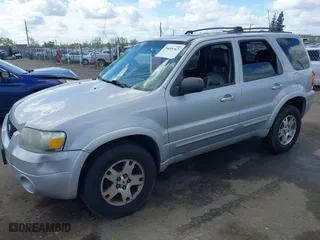 2005 Ford Escape Limited with VIN 1FMYU04165KB19009, listed as a IAAI auction lot 39055762 with 180,484 mi miles. Bid and sale history available at carsss.com. Image 2.