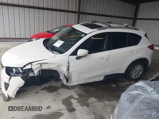 2014 Mazda CX-5 Touring with VIN JM3KE4CY9E0370610, listed as a IAAI auction lot 42016896 with 72,340 mi miles. Bid and sale history available at carsss.com. Image 13.
