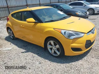 2012 Hyundai Veloster w/Gray Int z VIN KMHTC6AD9CU074244, wystawiony jako IAAI lot #42471609 z przebiegiem 117 402 mil mil oraz . Historia ofert i sprzedaży dostępna na DreamBid. Obrazek 1.