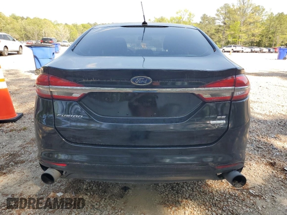 2017 Ford Fusion SE z VIN 3FA6P0H98HR328552, wystawiony jako Copart lot #52709395 z przebiegiem 188 451 mil mil oraz Szkoda całkowita • Salvage title. Historia ofert i sprzedaży dostępna na DreamBid. Obrazek 6.