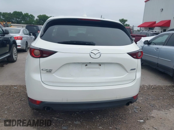 2017 Mazda CX-5 Touring z VIN JM3KFBCL5H0128584, wystawiony jako IAAI lot #42354669 z przebiegiem 56 563 mil mil oraz . Historia ofert i sprzedaży dostępna na DreamBid. Obrazek 16.