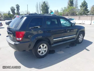 2010 Jeep Grand Cherokee Laredo with VIN 1J4PR4GK2AC104857, listed as a IAAI auction lot 42009569 with 131,986 mi miles. Bid and sale history available at carsss.com. Image 4.