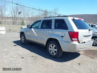 2010 Jeep Grand Cherokee Laredo with VIN 1J4PR4GK2AC125918, listed as a IAAI auction lot 41899078 with 236,229 mi miles. Bid and sale history available at carsss.com. Image 3.