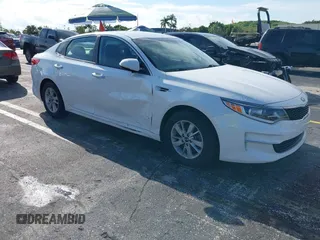 2016 Kia Optima LX z VIN KNAGT4L35G5083938, wystawiony jako IAAI lot #42023118 z przebiegiem 90 982 mil mil oraz . Historia ofert i sprzedaży dostępna na DreamBid. Obrazek 1.