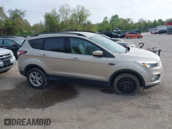 2018 Ford Escape SE z VIN 1FMCU9GD1JUB02119, wystawiony jako IAAI lot #42092393 z przebiegiem 69 309 mil mil oraz . Historia ofert i sprzedaży dostępna na DreamBid. Obrazek 13.