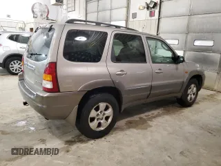 2001 Mazda Tribute LX with VIN 4F2CU08101KM05943, listed as a Copart auction lot 84077694 with 137,937 mi miles and Salvage Title. Bid and sale history available at DreamBid. Image 3.
