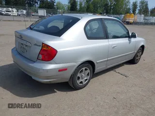 2005 Hyundai Accent GLS with VIN KMHCG35C65U332999, listed as a IAAI auction lot 42097932 with 225,593 mi miles. Bid and sale history available at carsss.com. Image 4.