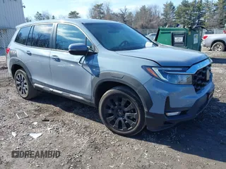 2023 Honda Passport EX-L with VIN 5FNYF8H59PB036474, listed as a IAAI auction lot 41771227 with 13,752 mi miles and . Bid and sale history available at carsss.com. Image 1.