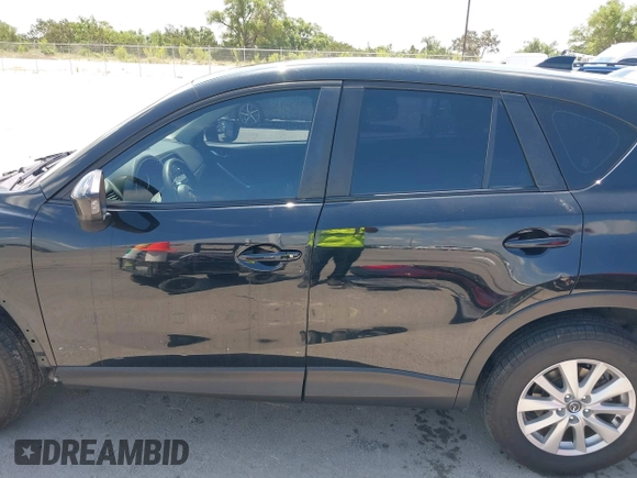 2014 Mazda CX-5 Sport with VIN JM3KE2BE9E0402015, listed as a IAAI auction lot 42098197 with 65,328 mi miles and . Bid and sale history available at carsss.com. Image 15.
