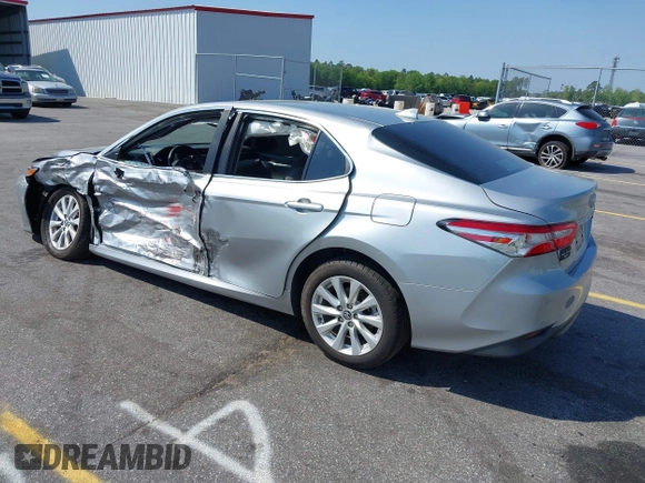 2020 Toyota Camry LE with VIN 4T1C11AK9LU341762, listed as a IAAI auction lot 42001577 with 84,991 mi miles and . Bid and sale history available at DreamBid. Image 3.