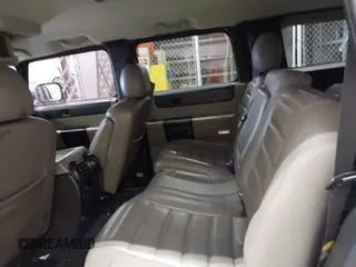2005 Hummer H2 SUV with VIN 5GRGN23U65H132505, listed as a IAAI auction lot 41515346 with 140,944 mi miles. Bid and sale history available at carsss.com. Image 8.