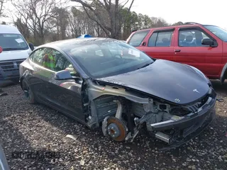 2023 Tesla Model 3 with VIN 5YJ3E1EAXPF666252, listed as a IAAI auction lot 42009929 with 27,328 mi miles and . Bid and sale history available at DreamBid. Image 14.