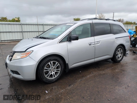 2012 Honda Odyssey EX-L with VIN 5FNRL5H68CB141022, listed as a Copart auction lot 54605485 with 185,388 mi miles and Salvage Title. Bid and sale history available at carsss.com. Image 1.