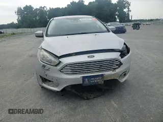 2017 Ford Focus Titanium with VIN 1FADP3N27HL251297, listed as a Copart auction lot 67373094 with 104,733 mi miles and Salvage Title. Bid and sale history available at carsss.com. Image 11.