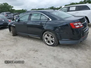 2015 Ford Taurus SE with VIN 1FAHP2D88FG136022, listed as a Copart auction lot 50944035 with 221,164 mi miles and Salvage Title. Bid and sale history available at DreamBid. Image 2.