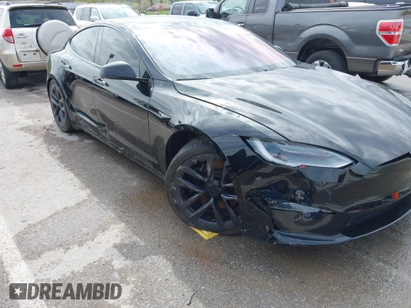 2022 Tesla Model S Plaid with VIN 5YJSA1E60NF460244, listed as a IAAI auction lot 41996403 with Not provided miles and . Bid and sale history available at DreamBid. Image 6.