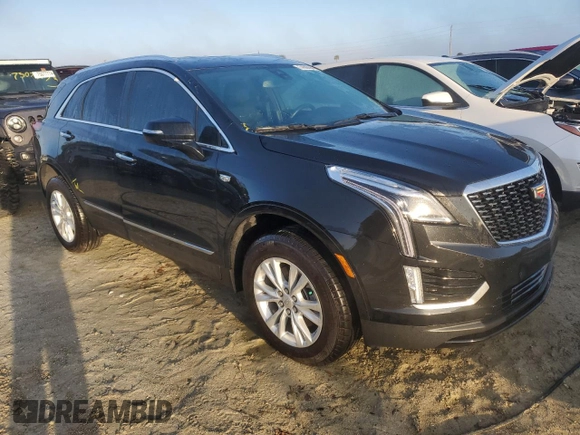2022 Cadillac XT5 FWD Luxury z VIN 1GYKNAR49NZ159814, wystawiony jako Copart lot #74506584 z przebiegiem 7 069 mil mil oraz Nie do naprawy • Non repairable. Historia ofert i sprzedaży dostępna na DreamBid. Obrazek 4.