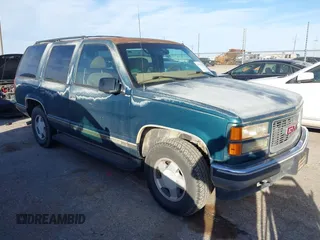 1997 GMC Yukon with VIN 1GKEK13R1VJ723409, listed as a IAAI auction lot 41512184 with 235,988 mi miles. Bid and sale history available at carsss.com. Image 1.