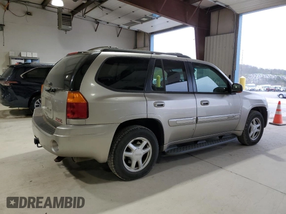 2003 GMC Envoy SLE z VIN 1GKDT13S432136642, wystawiony jako Copart lot #53467095 z przebiegiem 98 832 mil mil oraz Szkoda całkowita • Salvage title. Historia ofert i sprzedaży dostępna na DreamBid. Obrazek 3.