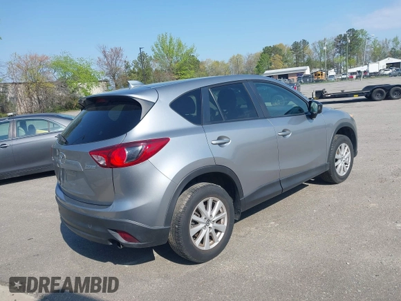 2014 Mazda CX-5 Touring with VIN JM3KE2CY9E0310315, listed as a IAAI auction lot 41943991 with 98,359 mi miles and . Bid and sale history available at carsss.com. Image 4.